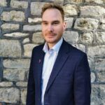 An image of Eligible Sales Director, Sam Harhat